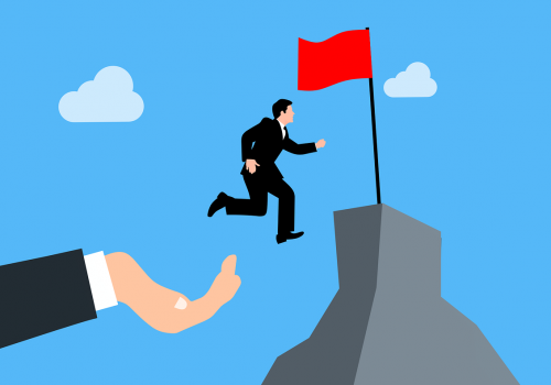 A helping hand from a business consultant to his client, preventing him from falling while shepherding him to his business goals.