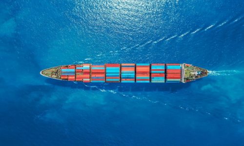 A cargo ship in the middle of the ocean ready to be invested more than twenty five million in business loans.