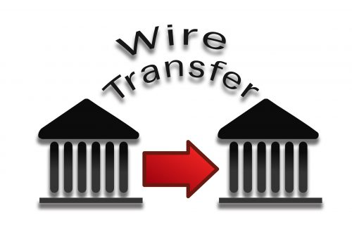 Wire transfer of money from a bank to a business, helping with business acquisition.